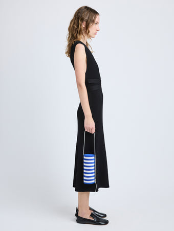 Proenza Schouler image of model carrying Silo Bag in Pieced Stripes in cobalt/white