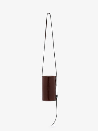 Proenza Schouler front image of Crossbody Silo Bag in Shiny Calf in cedar hanging vertically