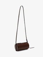 Proenza Schouler side 3/4 image of Crossbody Silo Bag in Shiny Calf in cedar