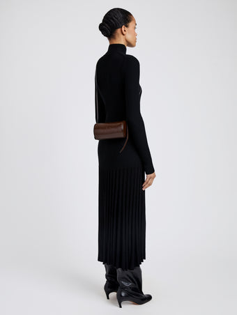 Proenza Schouler image of model wearing Crossbody Silo Bag in Shiny Calf in cedar