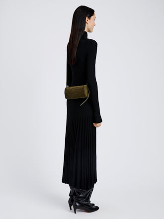 Proenza Schouler Image of model wearing Crossbody Silo Bag in Kid Suede in Olive