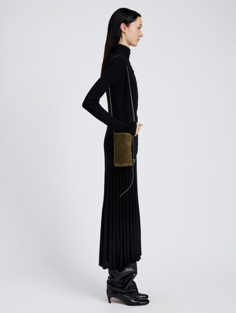 Proenza Schouler Image of model wearing Crossbody Silo Bag in Kid Suede in Olive