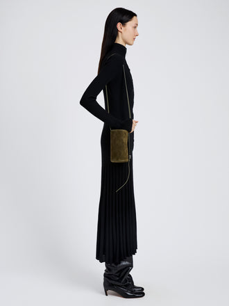 Proenza Schouler Image of model wearing Crossbody Silo Bag in Kid Suede in Olive