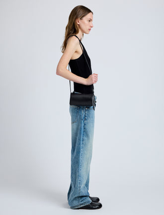 Image of model wearing Crossbody Silo Bag in Black