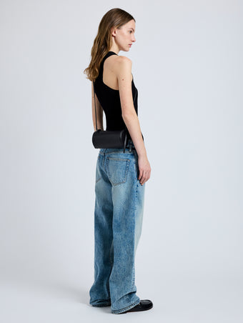 Image of model wearing Crossbody Silo Bag in Black