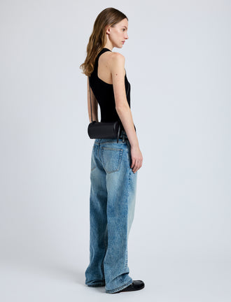 Image of model wearing Crossbody Silo Bag in Black