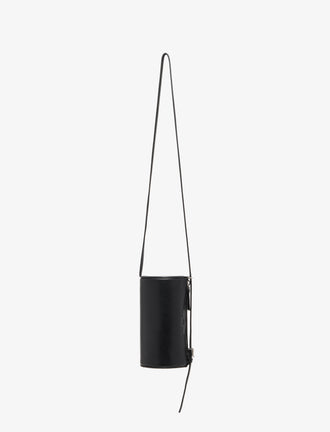 Front image of Crossbody Silo Bag in Black carried vertically