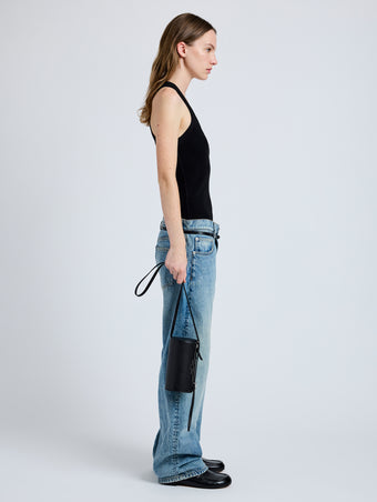 Image of model wearing Crossbody Silo Bag in Black