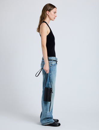 Image of model wearing Crossbody Silo Bag in Black