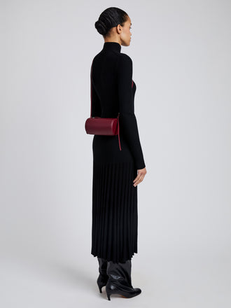 Image of model wearing Crossbody Silo Bag in Merlot