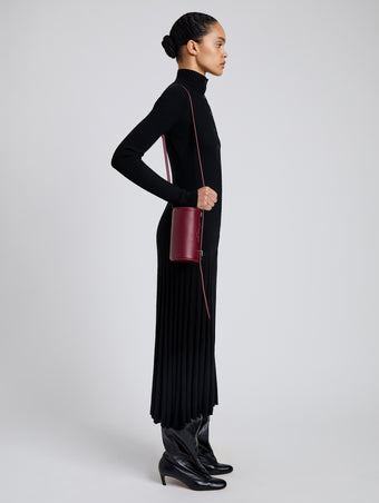 Image of model wearing Crossbody Silo Bag in Merlot