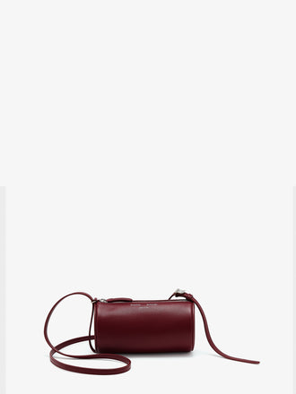 Front image of Crossbody Silo Bag in Merlot with strap folded down