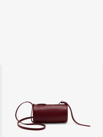 Front image of Crossbody Silo Bag in Merlot with strap folded down