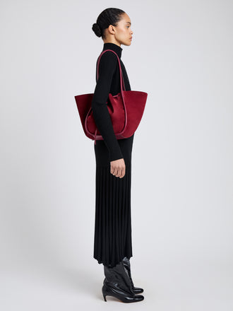 Image of model wearing Large Ruched Tote in Soft Suede in Merlot