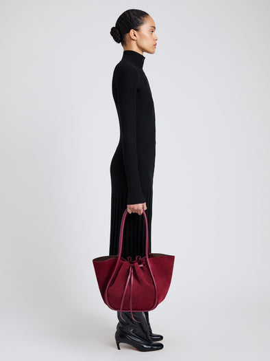Image of model wearing Large Ruched Tote in Soft Suede in Merlot