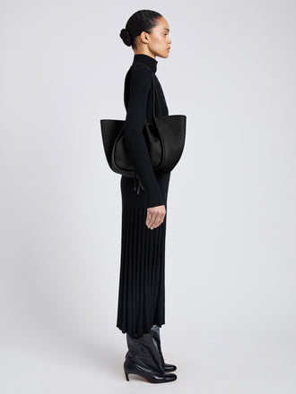 Image of model wearing Large Ruched Tote in Soft Pebbled Calf in Black