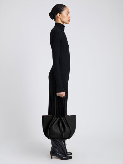 Image of model wearing Large Ruched Tote in Soft Pebbled Calf in Black