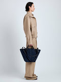 Proenza Schouler Image of model wearing Large Chelsea Tote in Soft Suede in Dark Navy
