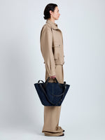 Proenza Schouler Image of model wearing Large Chelsea Tote in Soft Suede in Dark Navy