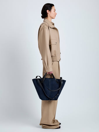 Proenza Schouler Image of model wearing Large Chelsea Tote in Soft Suede in Dark Navy