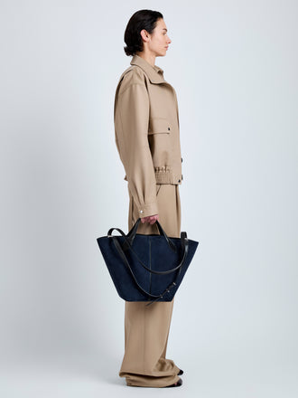 Proenza Schouler Image of model wearing Large Chelsea Tote in Soft Suede in Dark Navy