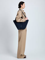 Proenza Schouler Image of model wearing Large Chelsea Tote in Soft Suede in Dark Navy