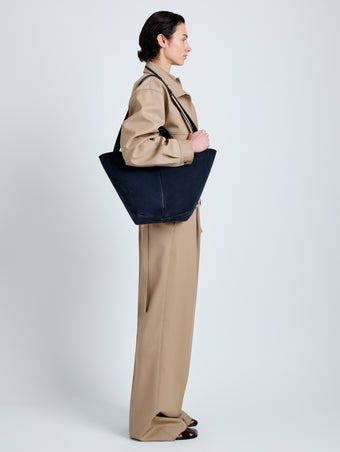 Proenza Schouler Image of model wearing Large Chelsea Tote in Soft Suede in Dark Navy