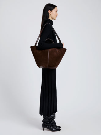 Image of model wearing Large Chelsea Tote in Soft Suede in Chocolate