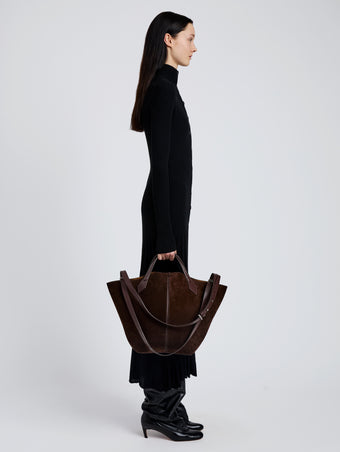 Image of model wearing Large Chelsea Tote in Soft Suede in Chocolate