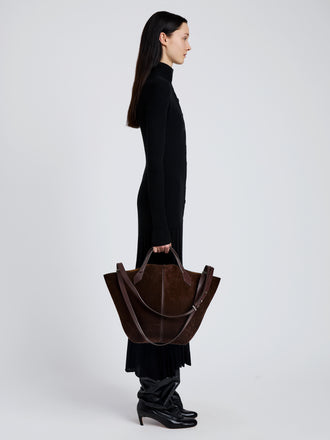 Image of model wearing Large Chelsea Tote in Soft Suede in Chocolate