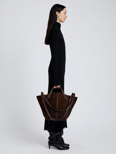 Image of model wearing Large Chelsea Tote in Soft Suede in Chocolate