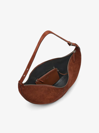 Proenza Schouler Aerial image of Hobo Slide Bag in Soft Suede in Rust