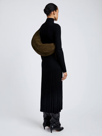 Proenza Schouler Image of model wearing Hobo Slide Bag in Soft Suede in Olive