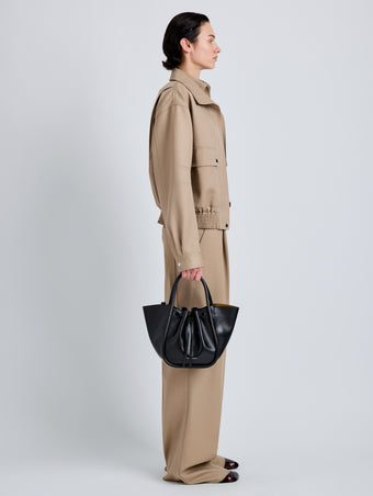 Proenza Schouler Image of model wearing Small Ruched Tote in Soft Shiny Calf in Black