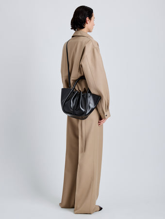 Proenza Schouler Image of model wearing Small Ruched Tote in Soft Shiny Calf in Black