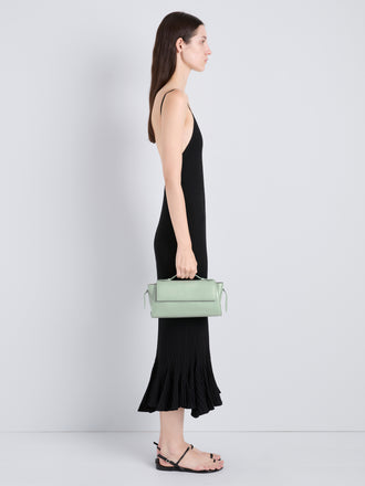 Proenza Schouler Image of model wearing Tate Clutch with Strap in Smooth Calf in Stone Blue