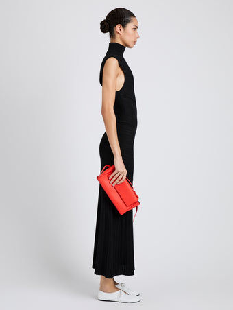 Proenza Schouler Image of model wearing Tate Clutch with Strap in Smooth Calf in Vermillion