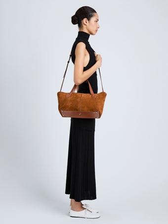 Proenza Schouler Image of model wearing East West Chelsea Tote in Soft Suede in Saddle