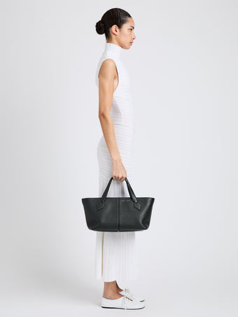Proenza Schouler Image of model wearing East West Chelsea Tote in Pebbled Calf in Black