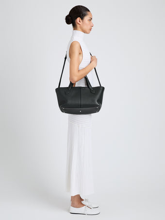 Proenza Schouler Image of model wearing East West Chelsea Tote in Pebbled Calf in Black