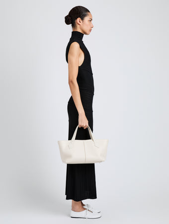 Proenza Schouler Image of model wearing East West Chelsea Tote in Pebbled Calf in Soft White