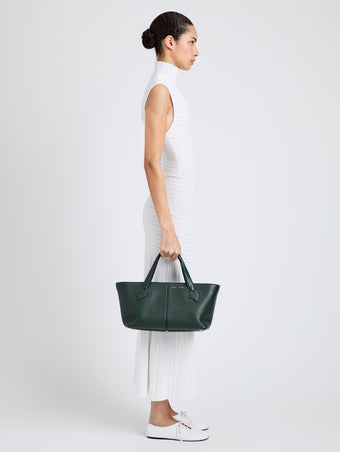 Proenza Schouler Image of model wearing East West Chelsea Tote in Pebbled Calf in Bottle