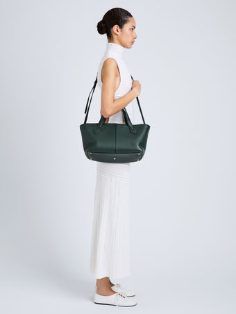 Proenza Schouler Image of model wearing East West Chelsea Tote in Pebbled Calf in Bottle