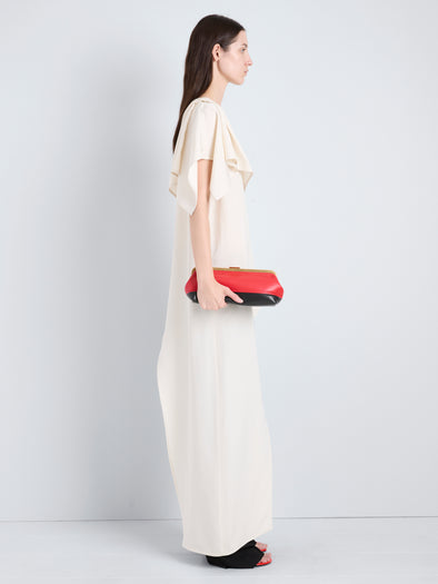 Proenza Schouler Image of model wearing Armory Clutch in Striped Nappa Plonge in TomatoBlack