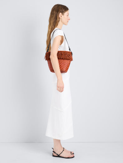 Proenza Schouler Image of model wearing the Bucket bag in Raffia in Rust
