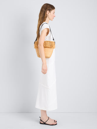 Proenza Schouler image of model wearing the Bucket bag in Raffia in Sand