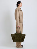 Proenza Schouler Image of model wearing Days Carryall in Perforated Suede in Olive