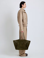 Proenza Schouler Image of model wearing Days Carryall in Perforated Suede in Olive