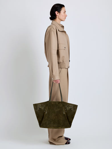 Proenza Schouler Image of model wearing Days Carryall in Perforated Suede in Olive