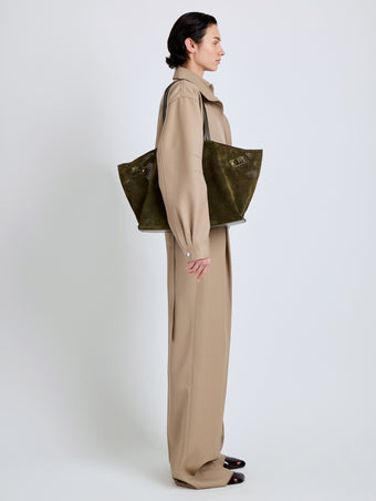 Proenza Schouler Image of model wearing Days Carryall in Perforated Suede in Olive